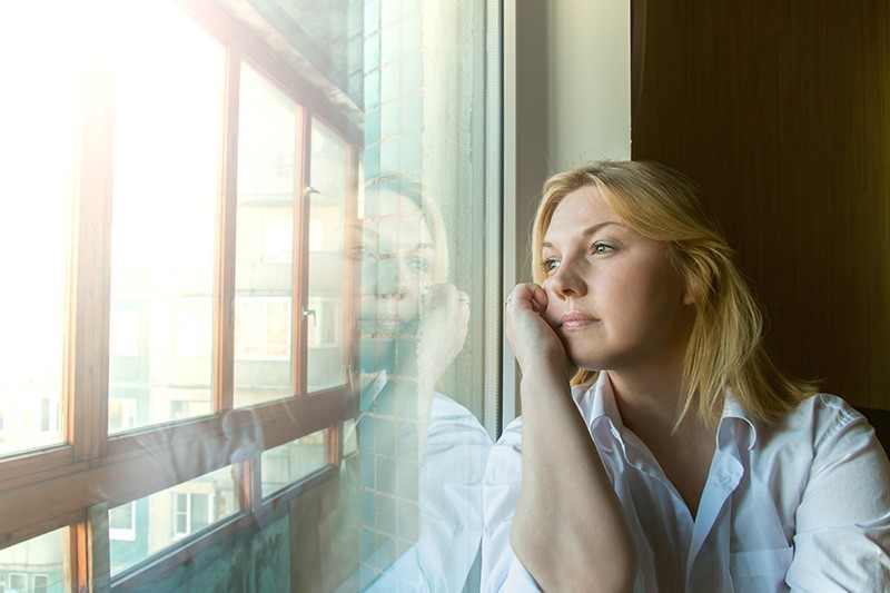 Woman Staring Out of the Window